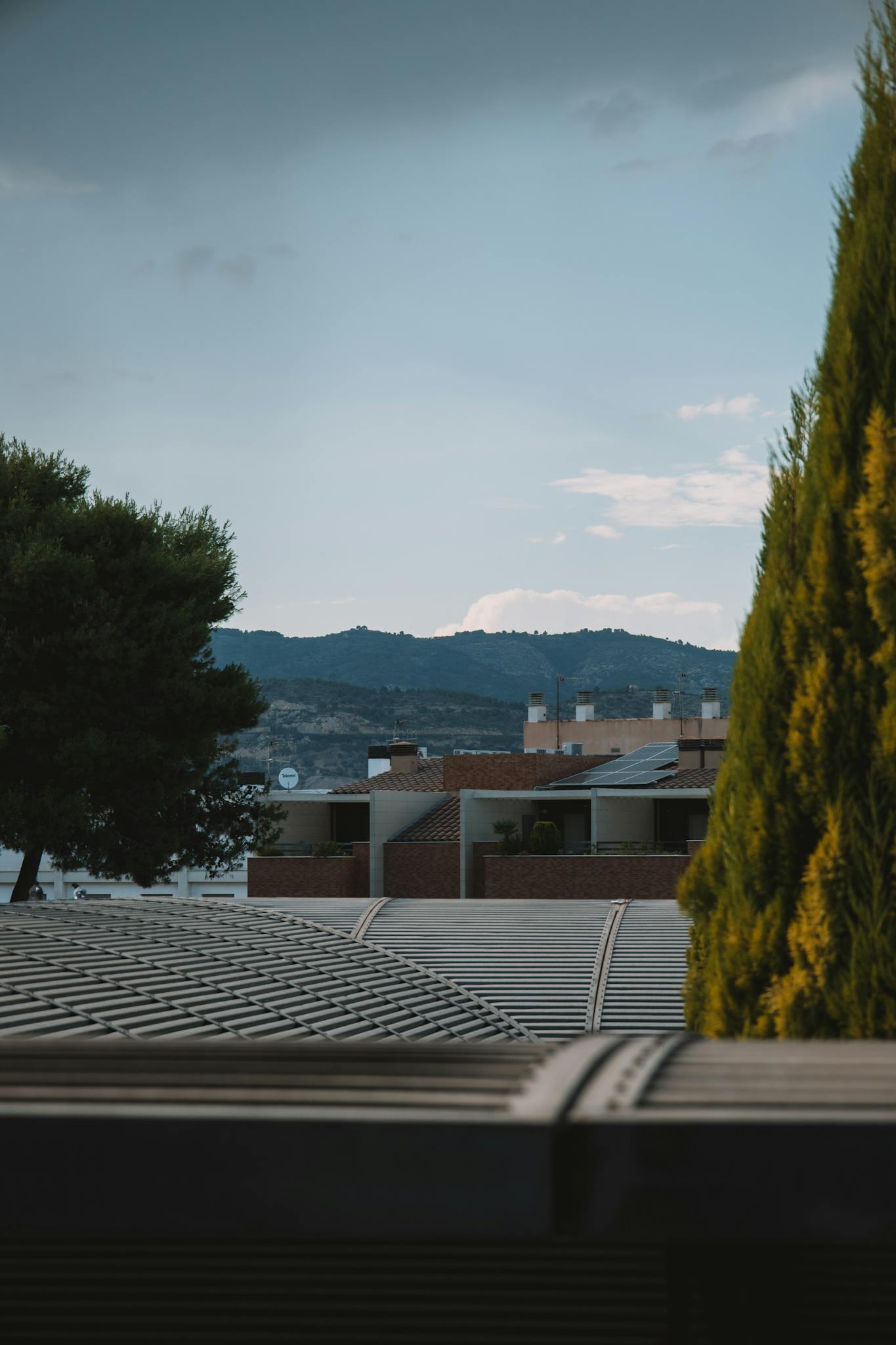 Urban residential scene with rooftops and hills in Valencia, Spain